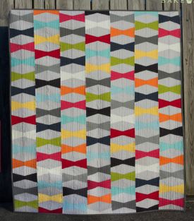 Modern fat quarter quilt pattern with bow tie design