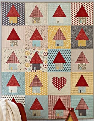 Layer cake quilt pattern with house motifs