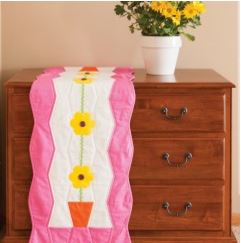 Quilted table runner pattern with flower design